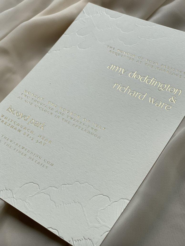 Wedding invitation by TLPS featuring gold foiling and emboss
