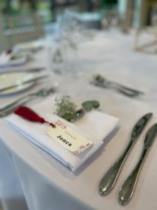 Place name with a red tassel on a table setting